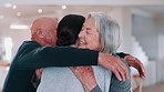 Senior, parents or daughter with hug and happy in living room of home for reunion with love. Family, man or woman with girl child, embrace or bonding in lounge of home for relationship, care or visit