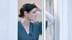 Sad woman, doctor and thinking by window in stress, mistake or anxiety from depression at home. Emotional or tired female person, nurse or medical caregiver in mental health, sick or wonder at house 