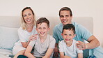 Happy family, face and smile in bedroom for love, profile picture and memory on bed of home or apartment. People, parents and children portrait with happiness for bonding, morning and care in house