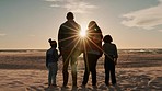 Sunset, holding hands and back of family at the beach on tropical vacation, holiday or weekend trip. Bonding, travel and children standing with their mother and father by the ocean or seaside.