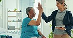 Physical therapy, senior woman and high five from health consultation and success in clinic. Working, rehabilitation and hospital with caregiver and healthcare worker with physiotherapy and patient