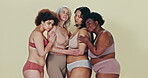 Body positivity, lingerie group and women hug, care and support diversity shape, skin wellness or fashion inclusivity. Community, studio friends and people hugging with underwear on green background