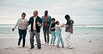 Grandparents, jumping and parents with kids on beach for bonding, playing and relax in nature by sea. Family, travel and senior mom, dad and children by ocean on holiday, vacation and adventure