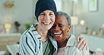 Friends, senior women and hug in home, care and bonding with cancer patient, funny and laugh together in reunion. Portrait, elderly people embrace and support, comfort and smile, happiness and trust