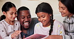 Parents, girl kids and bed with book, smile and reading with interracial love, care or laughing in house. African father, mother and daughter children in bedroom, listen or funny story at family home