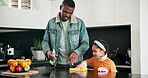 Father, daughter or child cleaning house or kitchen with spray for learning, germs and bacteria for clean home. Man or dad teaching girl to wipe surface with cloth to help with housework chores 