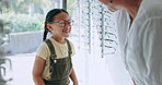 Woman, girl and eyewear shopping for glasses, purchase and smile for eyesight and eyecare. Happy, retail and grandparent for spectacles, buying and happiness for child, store and lens for eyeglasses
