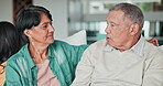 Face, retirement and a senior couple talking on a sofa in the living room of their home together. Love, relax or listening with an elderly man and woman in their apartment for conversation or bonding