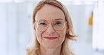 Optometry, glasses and face of senior woman in a clinic for vision, eye care or health with positive attitude. Happy, smile and portrait of female person from Mexico with spectacles in optical store.