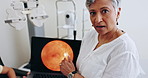 Face, woman and optometry with eye scan, retina and digital imaging with test results, vision service and analysis. Optician, employee or mature person with healthcare or optical coherence tomography