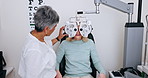 Ophthalmologist, woman and phoropter for eye exam, care and check vision at assessment in clinic. Senior optometrist woman, person and healthcare test for eyesight with medical consulting in hospital