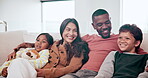 Mother, father and children watching on sofa in home or family development, bonding or relax holiday. Interracial, son and daughter hug on couch for youth safety or parent trust, vacation or weekend