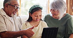 Home, grandparents and girl with a tablet, relax and happiness with internet, social media and streaming a video. Granny, granddad and child with technology, typing and funny with humor and laughing