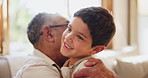 Running, love and grandfather hug child on sofa with support, trust and security at home. Happy, face and senior man embrace excited kid in living room for bond, fun and retirement with babysitting