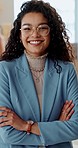 Happy, crossed arms and face of business woman in the office with positive, good and confident attitude. Smile, legal career and portrait of professional young female lawyer from Mexico in workplace.