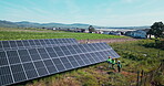 Drone, engineering or people with solar panels on farm for renewable energy, clean electricity or sustainability. Aerial view, employees or photovoltaic outdoor in nature for maintenance or work
 
