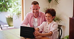 Father, son and tablet watching talking for streaming movie, entertainment or research. Man, boy or digital touch screen at table on holiday discussion or learn smile as relax vacation, social or app