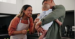 Baby, pacifier and a couple cooking in the kitchen of their home together for health, diet or nutrition. Food, smile or happy with a mama, papa and infant child using ingredients for supper or a meal