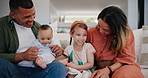 Happy family, newborn and parents with kid on sofa in home, bonding and connection. Mother, father and baby child in living room, girl laughing in healthy relationship and care, love or talk together