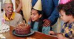 Birthday cake, family and kid blow candles with grandmother in celebration, party and clapping or cheers. Happy interracial people and girl or children with chocolate dessert for special day at home