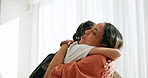 Love, happy and mother hugging her kid with backpack for school in the living room of family home. Smile, bonding and young mom embracing girl child with care in the lounge of house in the morning.