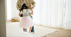 Father and daughter, dancing and love on floor, ballet and support in learning, bonding and care. Family time, play and fun at home, connection and trust in security, movement and tutu in childhood