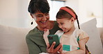 Grandmother, funny child and phone on sofa in home living room, bond or tickle. Happy grandma, smartphone and kid laughing in lounge, play or smile together on social media technology, meme or comedy