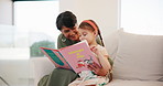 Happy, book and grandmother reading with child on a sofa in the living room of family home. Smile, love and senior woman in retirement bonding, relaxing and enjoying a story with girl kid in lounge.