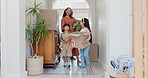 Real estate, family and children carrying boxes for relocation to a new home for investment or growth. Property, mortgage or moving house with a mother, father and kids in their together apartment