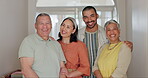 Smile, elderly parents and daughter or son with love, bonding and laugh in living room of home. Happy family, women and men with embrace in lounge of house for care, reunion or visit on a weekend