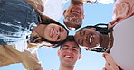 Students, friends and circle in low angle with face, smile or diversity outdoor in summer sunshine. Group, huddle and portrait at university with hug, solidarity or scholarship by blue sky background