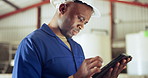 Black man, tablet and technician at warehouse for research, maintenance or inspection on site. African male person, contractor or engineer working on technology in online search or monitoring factory