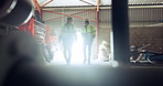 Warehouse, team and engineer walking, people talking and manufacturing on lens flare. Architect, man and woman in factory in conversation on digital tablet to check storage, distribution or logistics