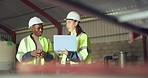 Teamwork, laptop and construction worker people in a warehouse for planning or discussion. Diversity, communication and industry with an engineer team together in a plant or factory for manufacturing