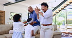 Mother, father and kids dance in home together for bonding, relax and healthy relationship. Black family, music and mom, dad and children having fun, happy and teaching dancer moves in living room