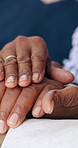Love, senior couple and holding hands for support, emotional healing or trust partner in marriage at home. Closeup, elderly people or rub hand with touch for care, kindness or gratitude in retirement