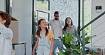 Happy family, door and moving in or walking in new home, property or investment together. Excited mother, father and children smile for relocation, building owners or apartment to explore at house