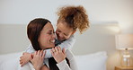 Bedroom, happy and mother hug child in home for love, bonding and loving relationship together. Family, parents and mom with young girl embrace for support, care and relaxing for childhood on bed