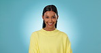 Portrait, indian woman and smile in studio for skincare, natural beauty and facial wellness on blue background. Cosmetic, person and happiness with face glow, shine and self care for healthy skin