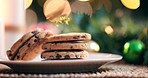 Christmas, cookies and home with holiday tree and plate with a dessert and sweet treat for santa. Homemade, house and living room with celebration and cooking with festive biscuits and pastry