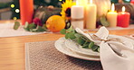 Thanksgiving, dinner and festive table for fine dining with plate, candles and decoration. Hosting, event and tableware setting for party, celebration or catering for meal in home, house or apartment