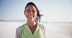 Summer, holiday and face of happy woman on beach, vacation and freedom to relax in nature. Mature, person and portrait with smile from health and wellness in Brazil sunshine, outdoor and blue sky