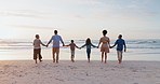 Back, holding hands and family with sunset, beach and vacation with ocean, water and support. Grandparents, mother and father with children, kids and ocean with adventure, sea and holiday on a break