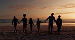 Big family silhouette, walking on beach and holding hands for support, holiday and summer vacation in sunset. Parents with children shadow by ocean, sea or nature for love, care and outdoor wellness