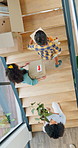 New home, box and above of parents and kids on stairs for moving day to property, apartment and house. Family, excited and top view of kids and mom carry boxes for mortgage, investment and relocation