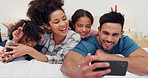 Happy family, love and bed selfie in a house with fun, games or peace hands for photography, memory or bonding. Bedroom, profile picture and children with parents, v sign or smile for social media