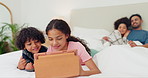 Kids, tablet and relax in bedroom, talk and learning online, gaming or cartoon. Children, happy family siblings and technology in bed with parents on digital app, website or internet together in home