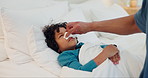 Father, hand and sick child with tissue in bed for fever, infection or illness in care or support at home. Closeup of ill kid, son or little boy blowing nose with dad in bedroom for virus or cold flu