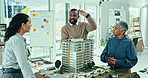 Business people, city model and architecture in office for design planning, development or project teamwork. Group engineering, manager or designer in collaboration with 3d building and prototype