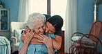 Homecare, hug and senior woman with nurse in a living room with care, trust and love, support or gratitude. Kindness, empathy and female caregiver embrace elderly person with kindness in nursing home
